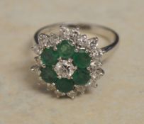 18ct white gold emerald and diamond cluster ring, approx 0.