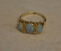 18ct gold three stone opal and diamond ring, opals of good quality and colour,