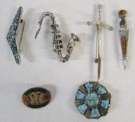 4 silver brooches inc saxophone & 2 others