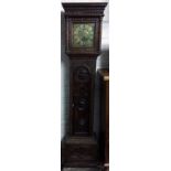 18th century 30 hour longcase clock in a heavily carved oak case with single hand & brass dial