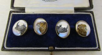 18ct gold reverse crystal intaglio cufflinks depicting lions and rhinoceros total weight 14.