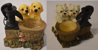 2 indoor water features in the shape of a small well with two puppies overlooking