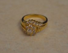 18ct gold diamond cluster ring flanked by diamond twists either side, approx 0.