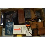 Various vintage cameras and accessories including flashes, lenses,