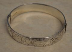 1970s silver bangle with an all over design, total approx weight 0.