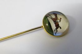 14ct gold reverse crystal intaglio stick pin of a horse and jockey