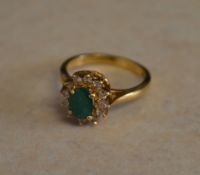 18ct gold emerald and diamond cluster ring,