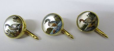 3 18ct gold reverse crystal intaglio buttons depicting wildfowl all initialled marked 18K