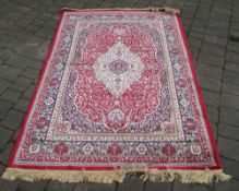 Red ground Cashmere rug with traditional medallion design 200 cm x 140 cm