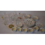 Various glassware including branded drinking glasses and a part tea/dinner service