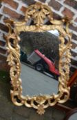 Ornate gilt framed wall mirror