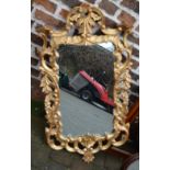 Ornate gilt framed wall mirror