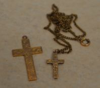 2 9ct gold crosses, one on a yellow metal chain,