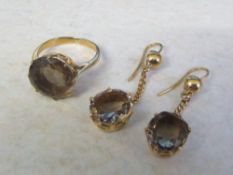 Tested as 15ct gold smokey quartz ring, size K/L and earrings total weight 10.