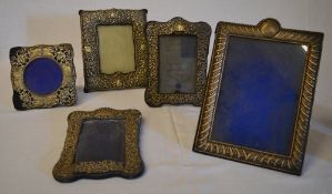 4 silver photo frames and one similar,