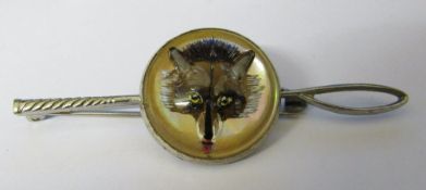 White metal reverse crystal intaglio brooch of a fox mask with crop bar