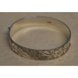 1970s silver bangle with floral decoration, total approx weight 0.