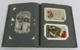 Postcard album containing vintage greetings cards