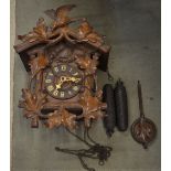 Black Forest style cuckoo clock with pendulum and weights
