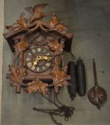 Black Forest style cuckoo clock with pendulum and weights