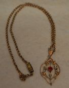 9ct gold drop pendant with a synthetic ruby and seed pearl on a 9ct gold chain,