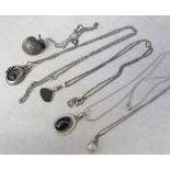 Assorted silver necklaces and pendants