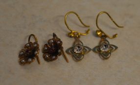 Pair of 9ct gold and CZ earrings and a pair of 15ct gold earrings in the shape of flowers,