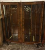 1930's serpentine front display cabinet H118cm by 103cm