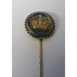 Yellow metal reverse crystal intaglio stick pin of a crown