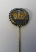 Yellow metal reverse crystal intaglio stick pin of a crown