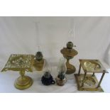 Selection of paraffin lamps and brass trivets