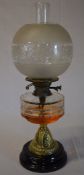 Brass paraffin lamp with ornate frosted glass style shade