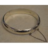 Silver bangle with safety chain, total approx weight 0.