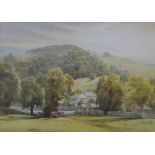 Framed watercolour of a landscape scene with cattle in foreground signed C W Taylor