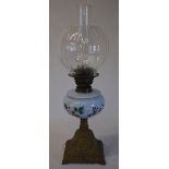 Bronze effect paraffin lamp with decorative floral painted shade