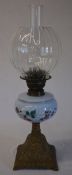 Bronze effect paraffin lamp with decorative floral painted shade