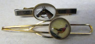 Gilt metal Stratton reverse crystal intaglio tie clip of a pheasant together with a horse tie clip