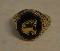 9ct gold mens signet ring depicting a roaring tiger, total weight approx 5.