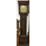 Georgian 8 day longcase clock in a carved oak case with a brass dial, maker Walter Archer.