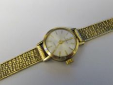 9ct gold ladies Garrard quartz wrist watch with 9ct gold strap