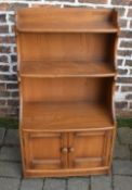 Small Ercol mid brown cabinet / book shelf H 111 cm, W 61 cm,