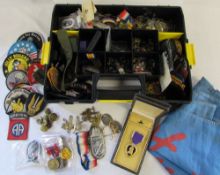 Quantity of military cap badges, patches, medal ribbons, buttons, Purple Heart and other medals,