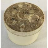 Small Japanese Meiji period ivory pot with ornately carved lid depicting lions, tigers,