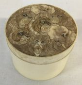 Small Japanese Meiji period ivory pot with ornately carved lid depicting lions, tigers,