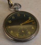 A GS TP Swiss made WWII period pocket watch with black dial,