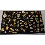 Large board of mixed costume jewellery brooches