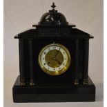 Late 19th century black slate mantle clock of classical form with Corinthian columns