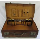 Vintage leather suitcase with accessories inc silver topped bottles London 1904,