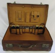 Vintage leather suitcase with accessories inc silver topped bottles London 1904,