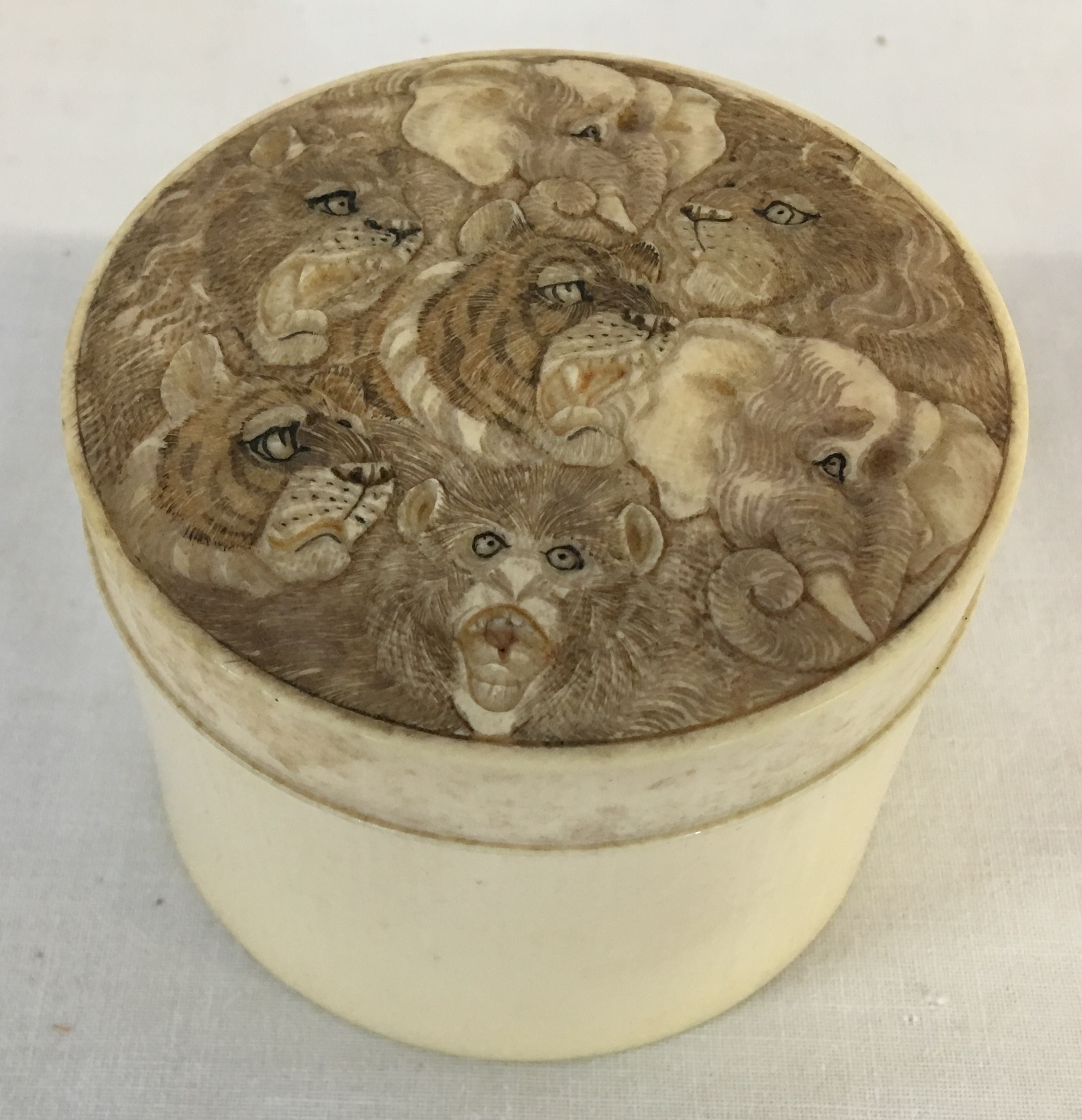 Small Japanese Meiji period ivory pot with ornately carved lid depicting lions, tigers, - Image 2 of 4